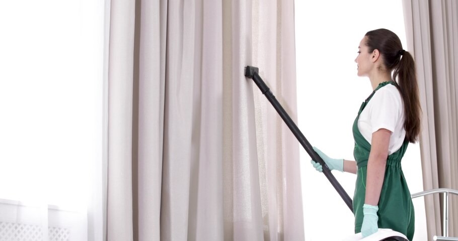 How do professionals refurbish damaged curtains after cleaning?